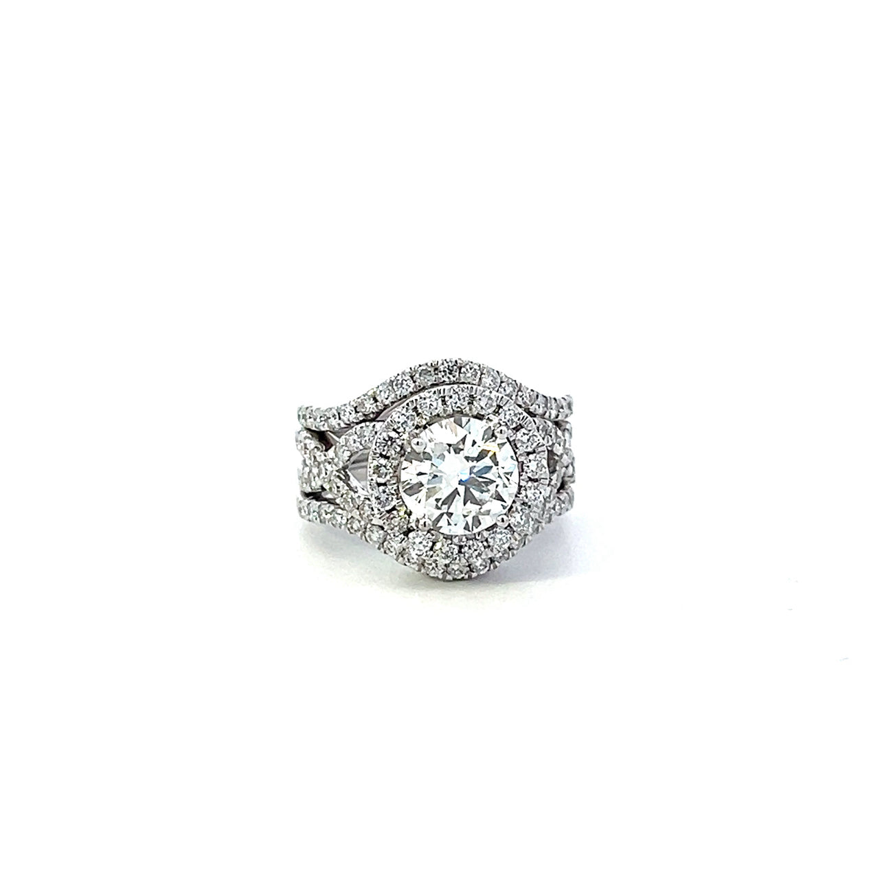 T 582 2486 - Diamante Central con Doble Halo Ondulado de Diamantes.
